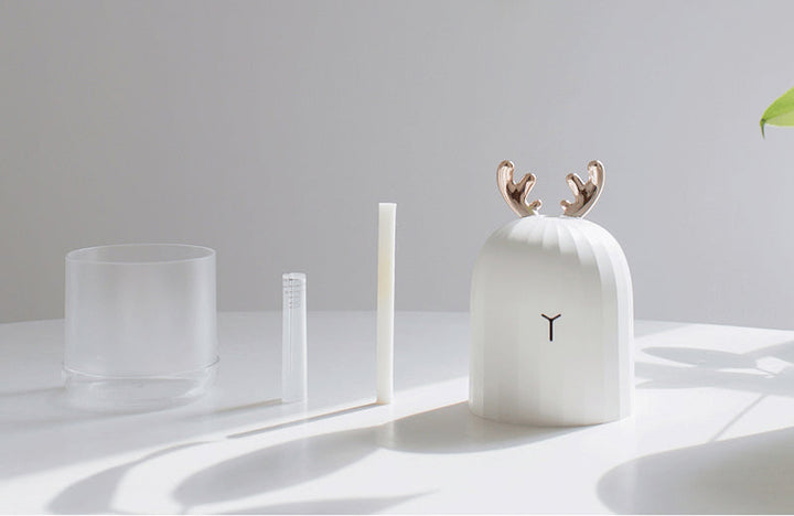 Nursery humidifier with cute bunny motif. Gentle night light, USB powered for child's peaceful sleep.