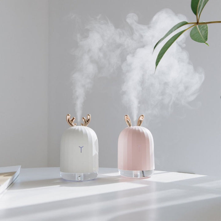 Cute fawn humidifier & air purifier for kids' rooms. USB charge, soft night light for peaceful sleep.