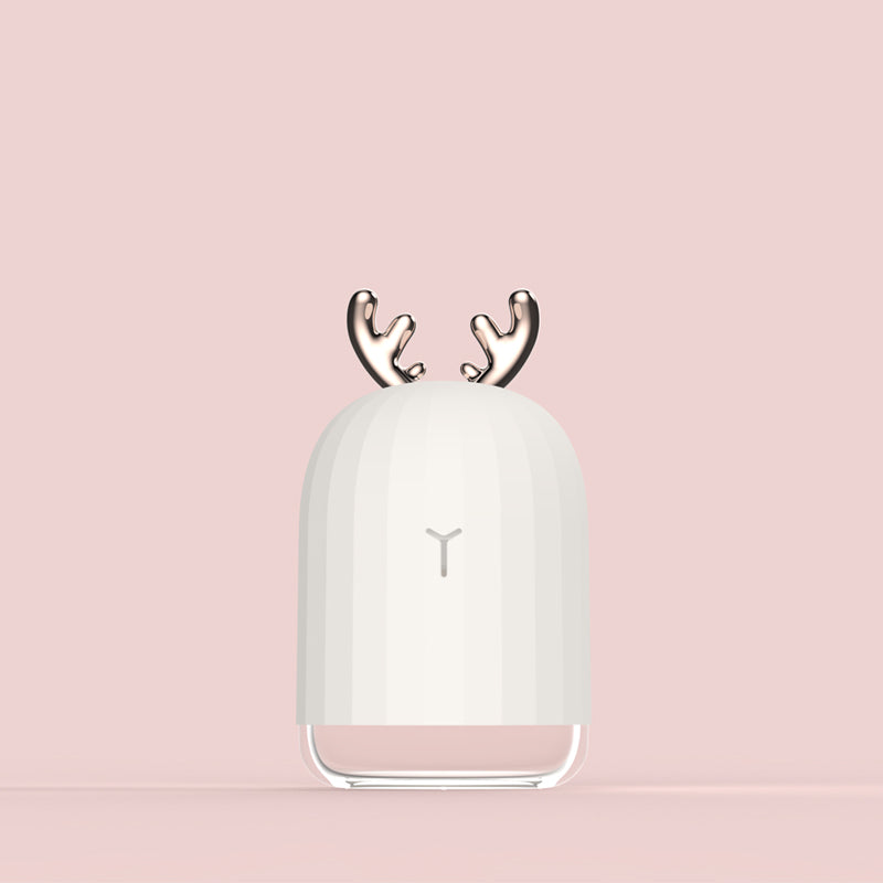 Baby nursery humidifier with charming bunny design. Soothing night light & convenient USB power.