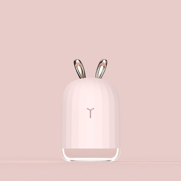Compact PureBunny humidifier & night light for kids. USB powered, ideal for child's bedroom.