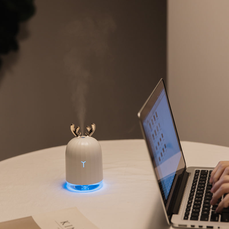 Portable kids' humidifier with a friendly fawn character. USB power & soft glow night light for bedtime.