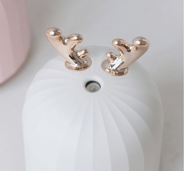 USB children's room humidifier, PureBunny edition. Integrated night light for infant comfort.