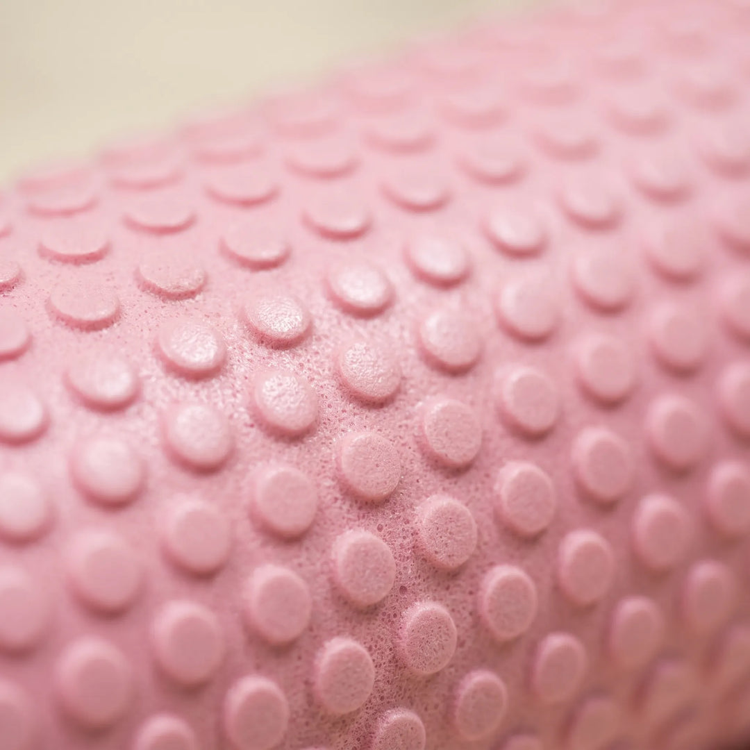 Durable purple high-density foam fitness roller for effective workout recovery & flexibility.