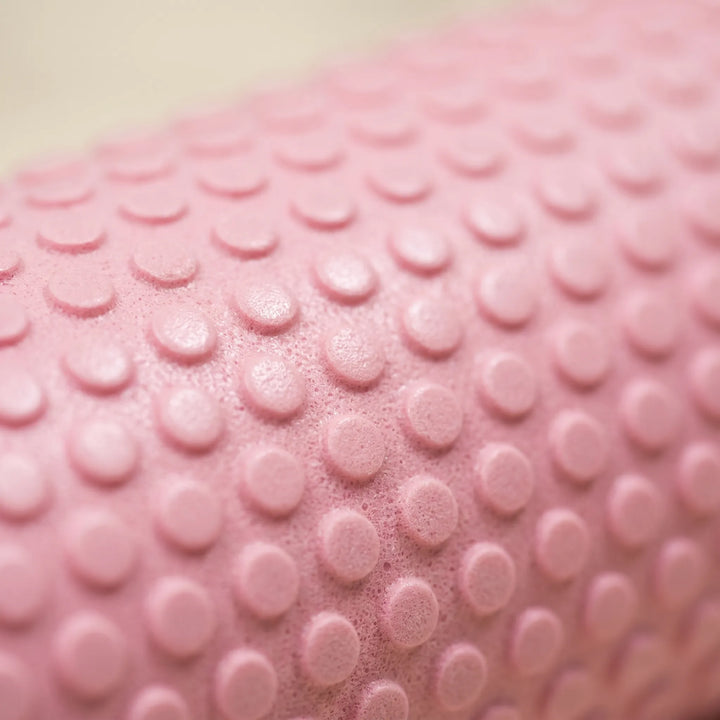 Durable purple high-density foam fitness roller for effective workout recovery & flexibility.