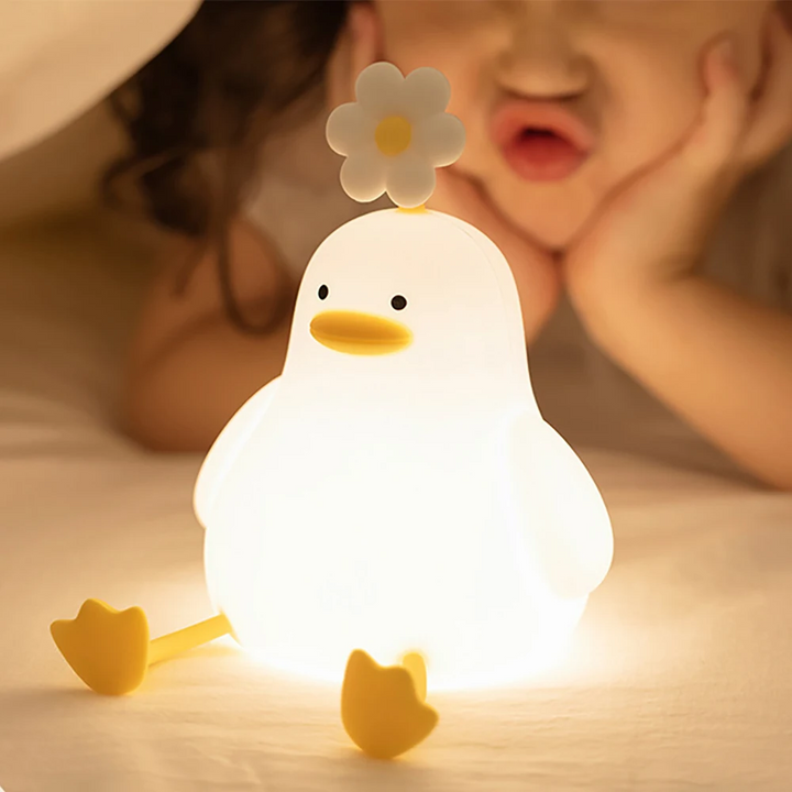 Adorable duck LED nightlight, QuackLight, provides a calming, soft glow for baby's nursery or kids' bedtime.