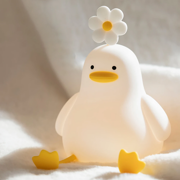 LED duck night light for kids, QuackLight, provides a soft, warm glow, ideal for a baby's nursery.