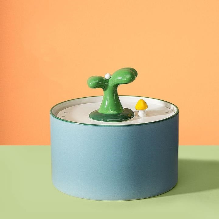 Quiet automatic ceramic pet fountain, ensures clean filtered water for cat hydration.