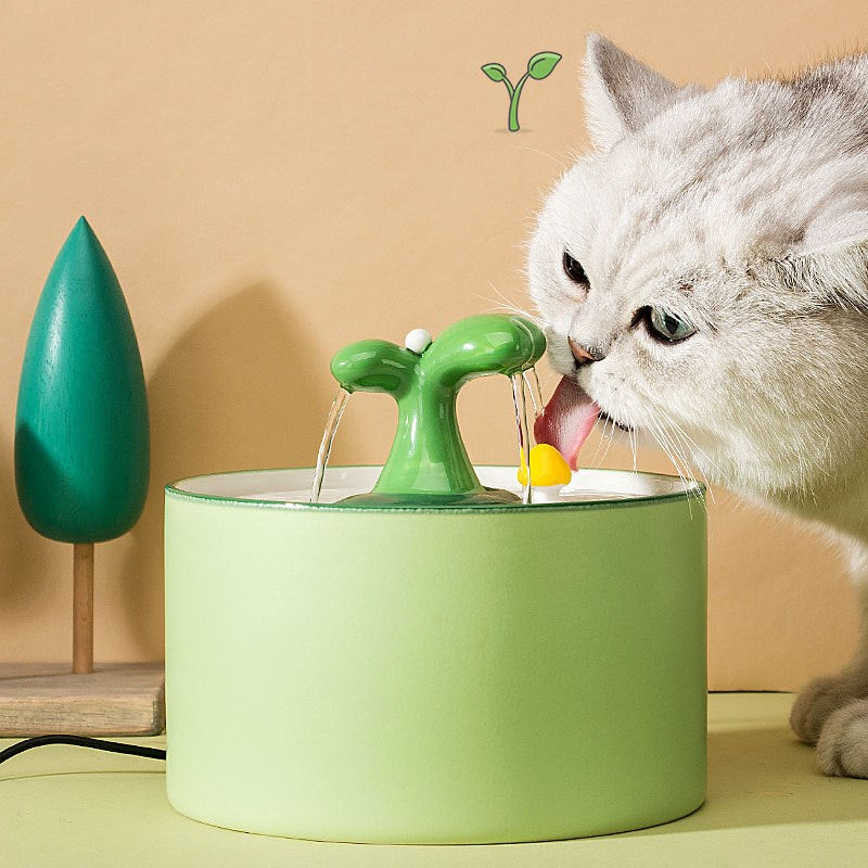 Blue ceramic pet water dispenser, automatic and quiet, promoting cat hydration.
