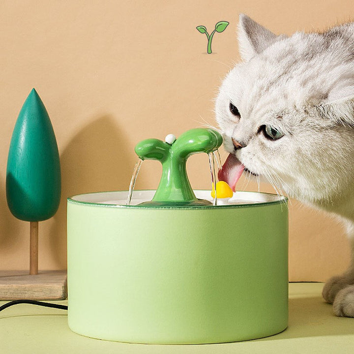 Blue ceramic pet water dispenser, automatic and quiet, promoting cat hydration.