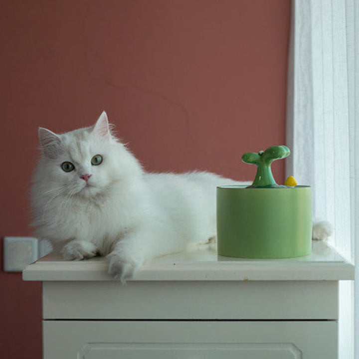 Modern ceramic cat fountain, a quiet pet water dispenser & essential cat accessory.