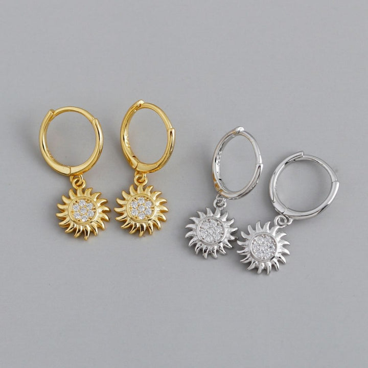 Beautiful women's gold & silver sun drop earrings. Stylish celestial jewelry, a radiant gift for her.