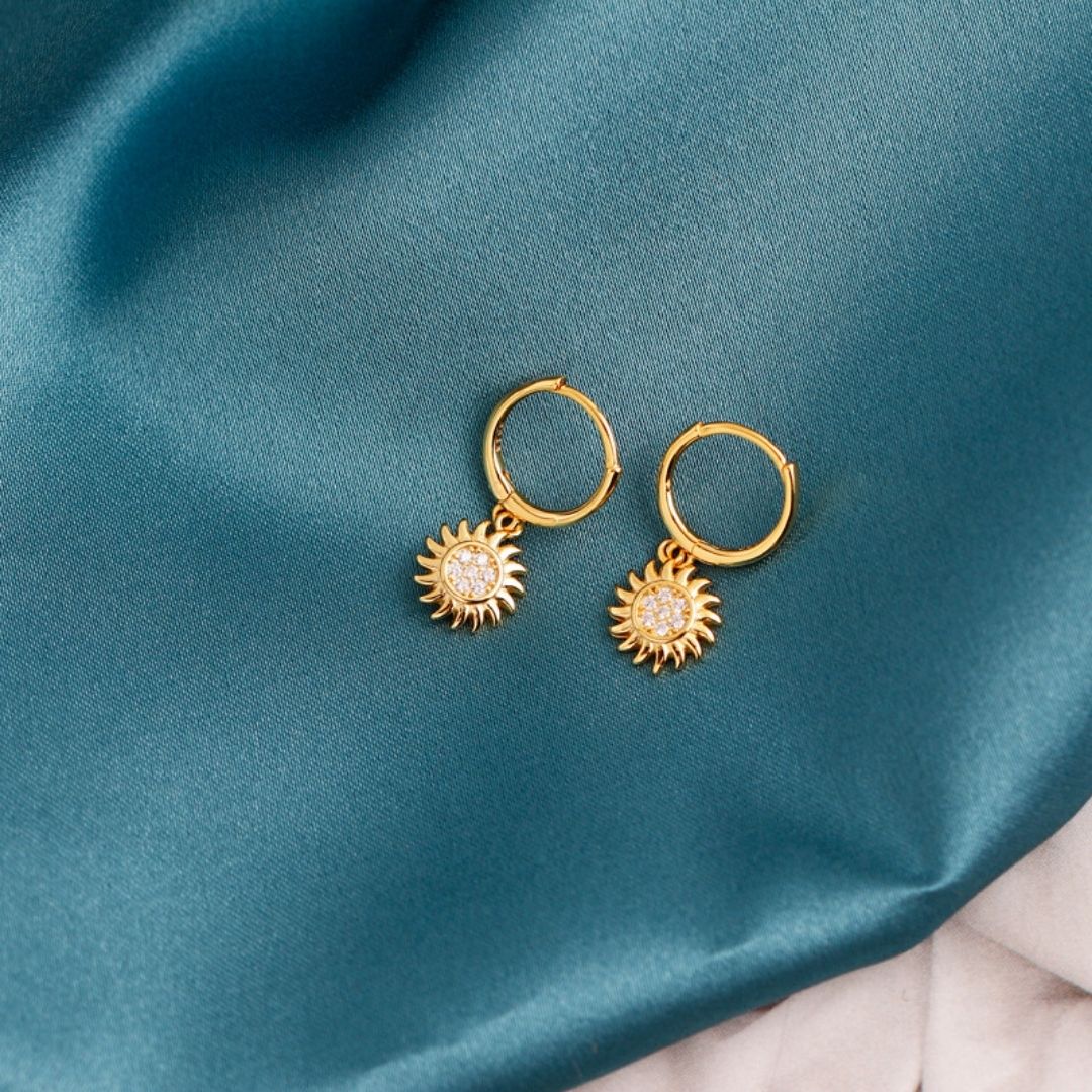 Fashionable women's gold & silver sun drop earrings. Versatile celestial jewelry, a radiant style statement.