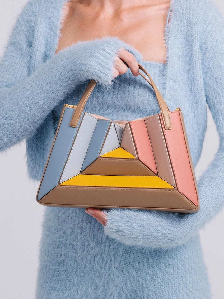 Radiant sculptural women's handbag made from ethical vegan leather. Perfect fashion statement purse.