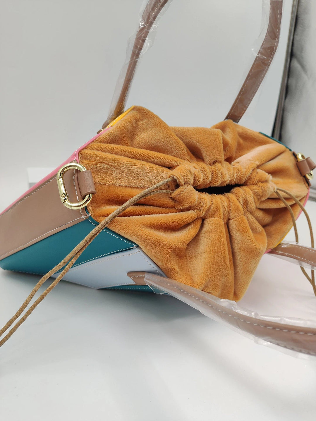 Chic vegan leather women's handbag with a unique sculptural design. Ethical fashion accessory for modern style.