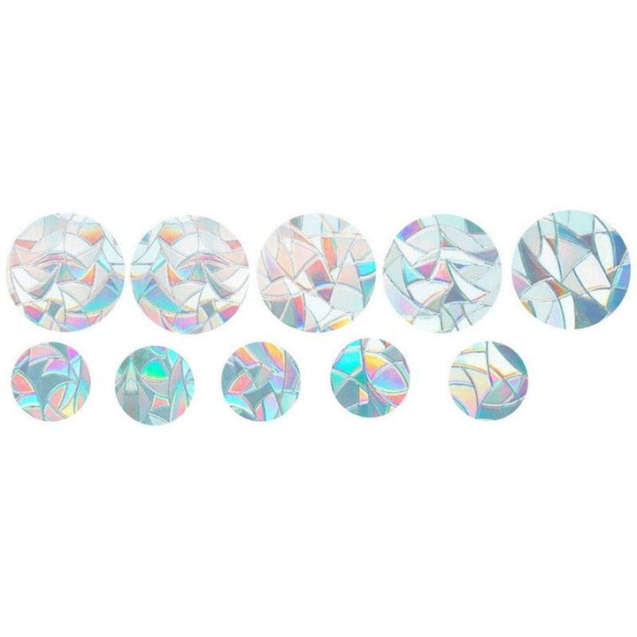 A child's room decorated with rainbow light patterns from a Zonvanger Raamsticker sun catcher decal.