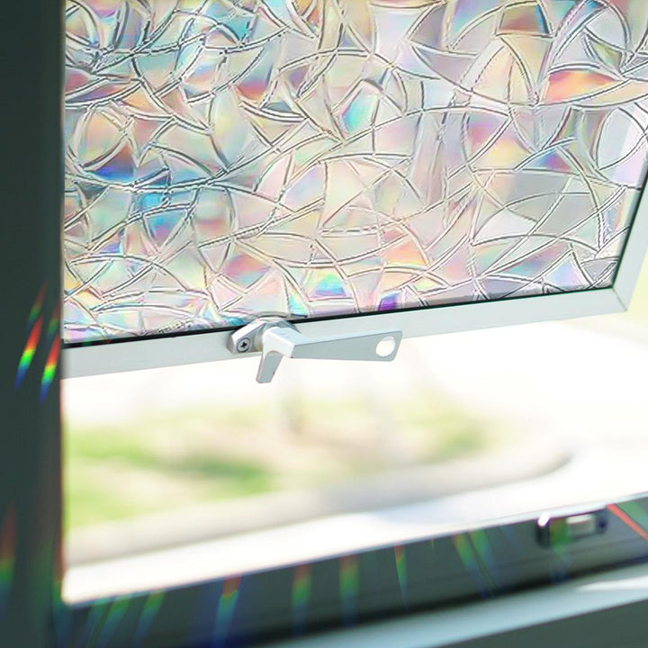 Geometric sun catcher window decals, casting multiple rainbows, enhancing home decor while preventing bird strikes.