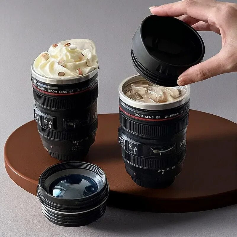 Realistic camera lens coffee mug, black, stainless steel interior for photographers & tech lovers. Novelty gift.
