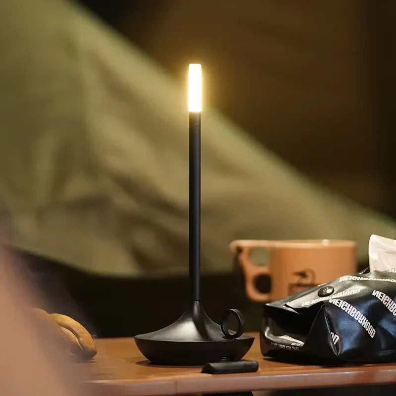 Rechargeable dimmable LED candle table lamp, modern design for ambient lighting in bedroom or patio. Portable.