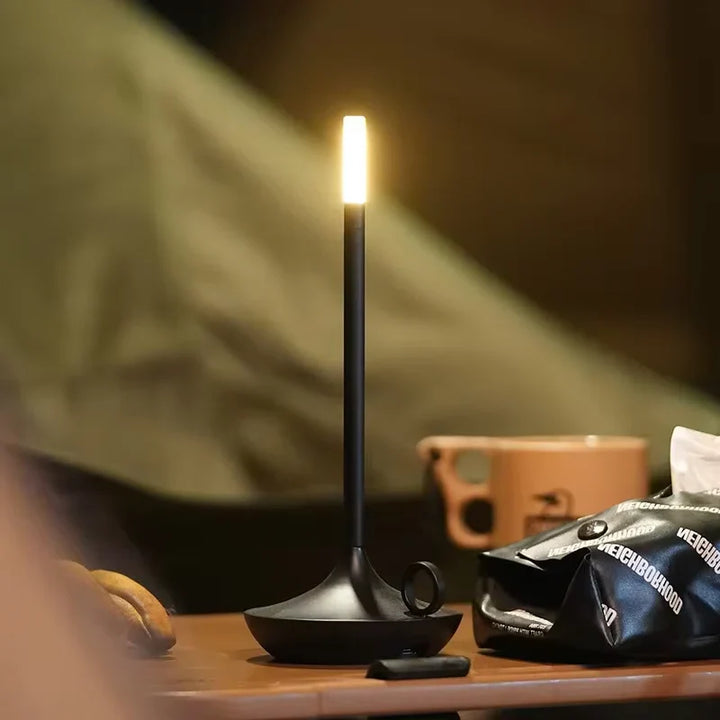 Rechargeable dimmable LED candle table lamp, modern design for ambient lighting in bedroom or patio. Portable.
