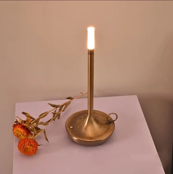 Portable rechargeable dimmable candle lamp, ideal LED table light for modern bedroom decor, camping, or ambient settings.