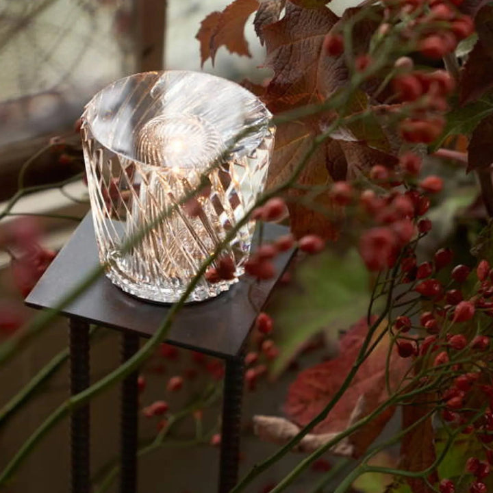 Sophisticated LED crystal lamp, diamond-cut design, rechargeable table light.