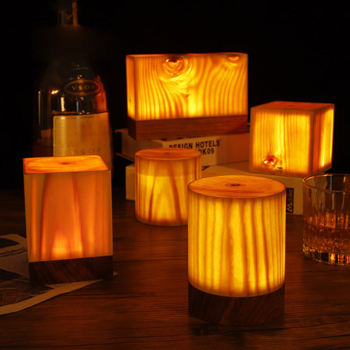 Rechargeable LED table lamp with elegant wood grain design for modern home decor.