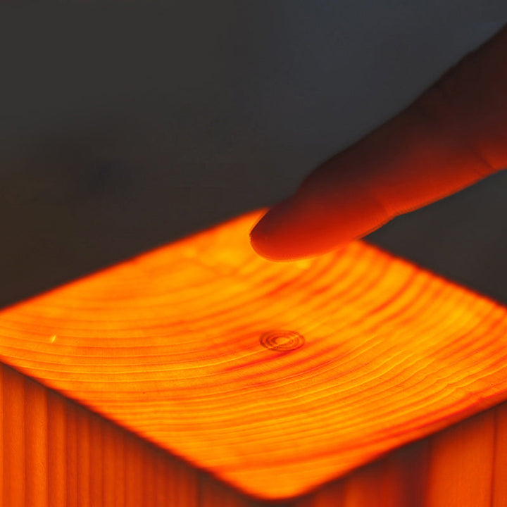 Elegant rechargeable LED lamp, wood grain design, perfect for living room accent.