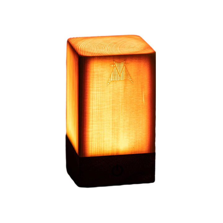 Cordless LED lamp with stylish wood grain design, great for bedrooms or offices.