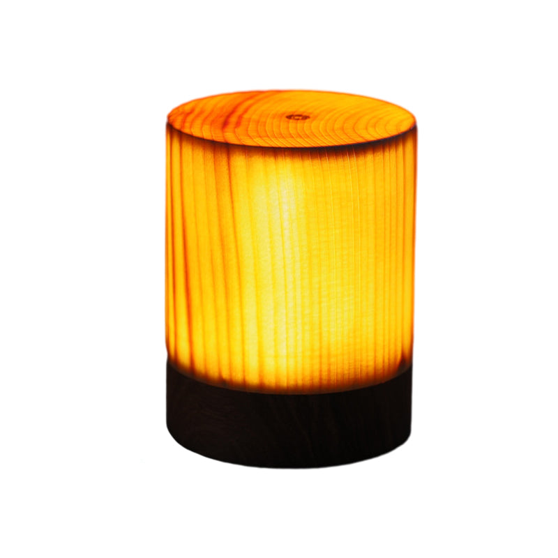 Decorative LED table lamp, wood grain texture, providing soft, ambient illumination.