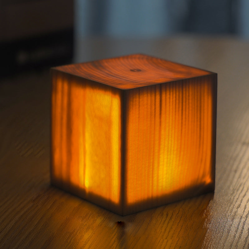 Modern LED table lamp, portable and rechargeable, with a beautiful wood grain design.