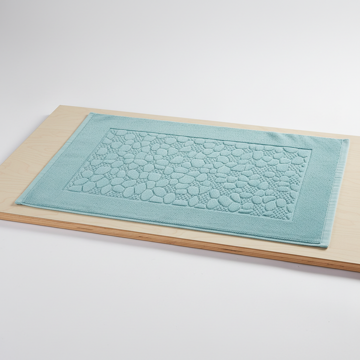 CottonMat rectangular bath mat, natural cotton, absorbent, providing soft comfort and chic bathroom decor.