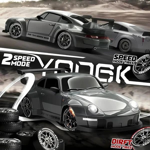 Fast 4WD remote control drift car with blue LED lights, blurring past on a race track, demonstrating speed.