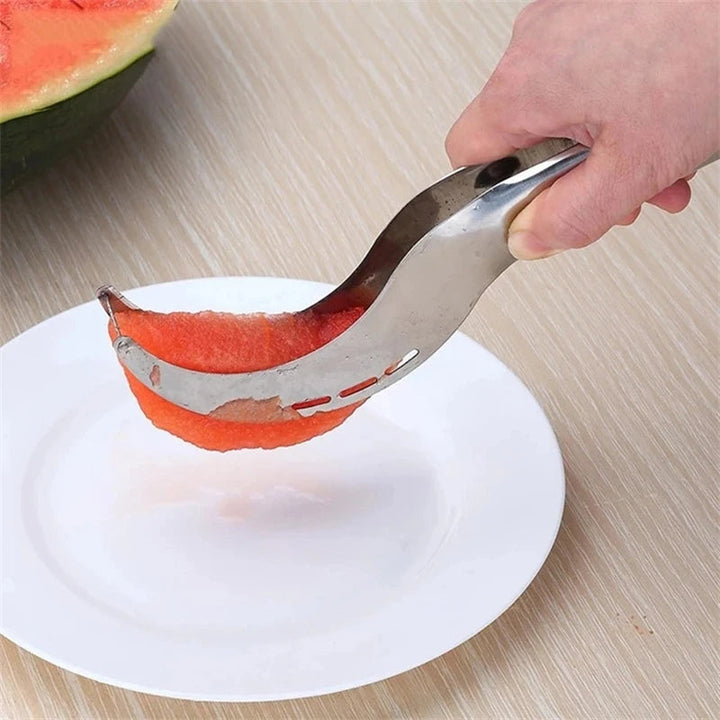 Green Kitchen FruitFlow slicer, a handy gadget for fast fruit prep. Easy clean stainless steel design.