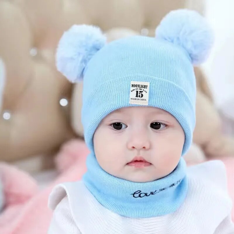 Red knitted winter beanie for children with a fluffy pom pom, perfect for cold weather warmth