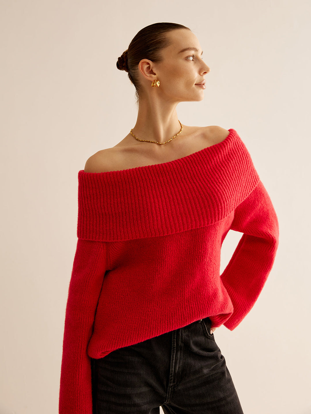 Livia women's red off-shoulder knit sweater. Fashionable & warm long-sleeve top for elegant fall and winter outfits.