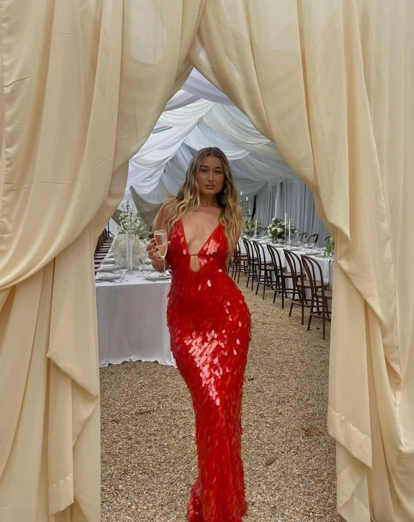 Red sequin backless prom dress showcasing a mermaid silhouette. A sophisticated formal evening gown for women.