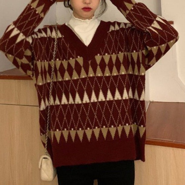 Comfortable red loose fit women's sweater. Aesthetic long sleeve pullover top for chic everyday casual fashion.