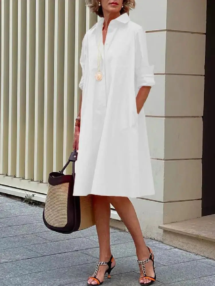 Stylish women's button-front A-line midi dress. Relaxed fit, long sleeves, knee length; ideal for office or everyday fashion.