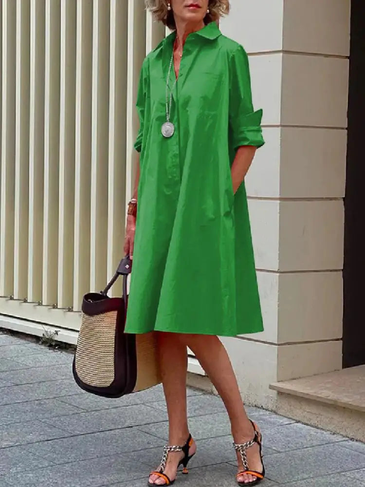 Elegant women's relaxed fit midi shirt dress with full button front. A-line design, versatile for casual wear or office fashion.