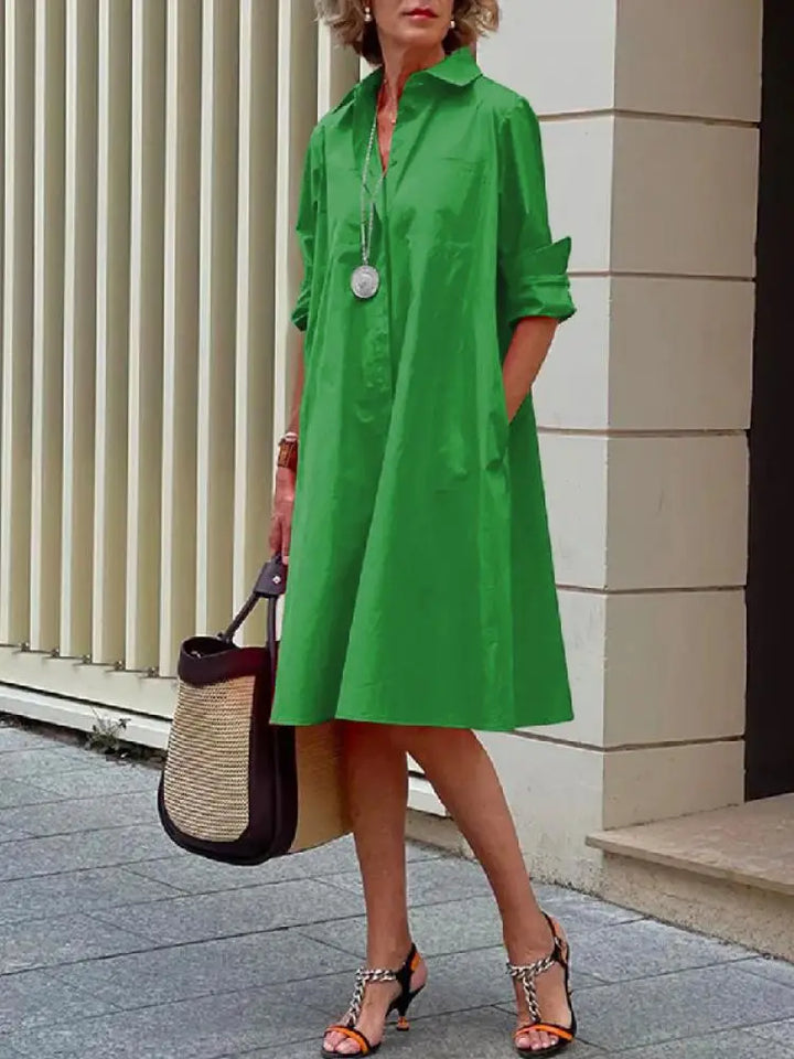 Elegant women's relaxed fit midi shirt dress with full button front. A-line design, versatile for casual wear or office fashion.