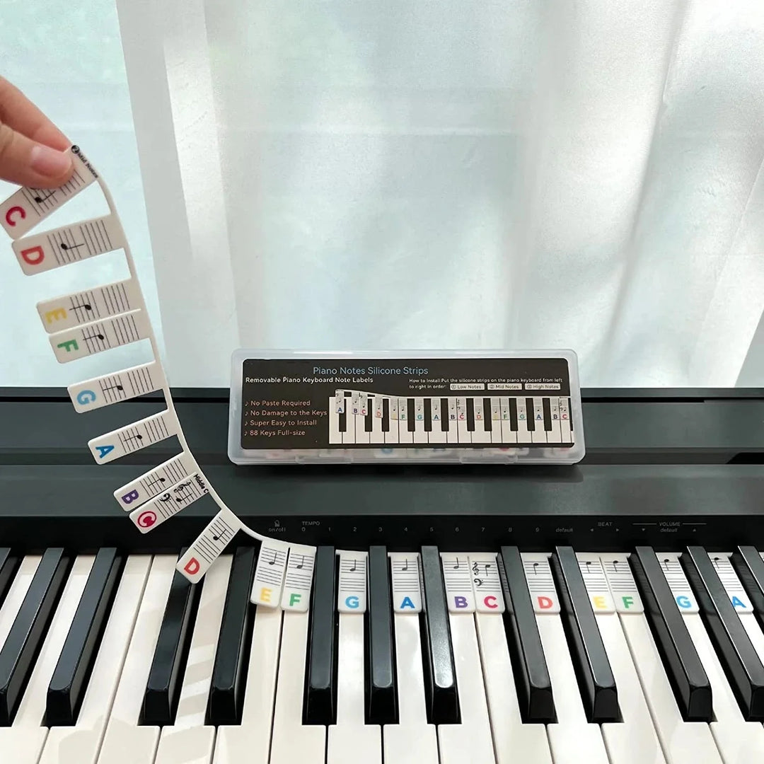 Reusable silicone piano note guide for easy keyboard learning. Removable strips help beginners practice music.