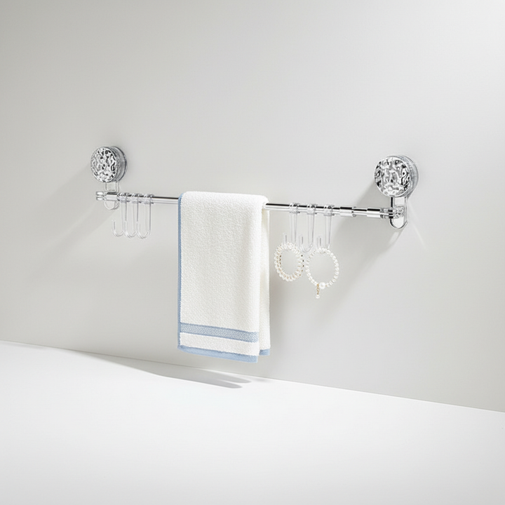 Close-up of retractable wall mount rack hooks, showing strong hold for various items, drill-free, space-saving storage solution