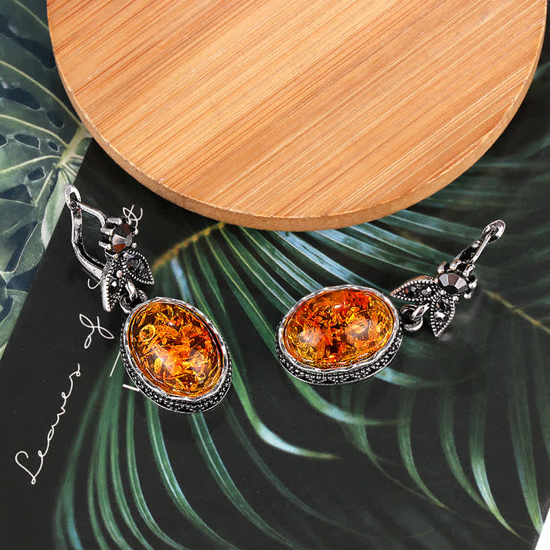 Elegant silver retro flower dangle earrings for women, featuring beautiful amber stones.