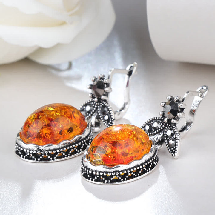 Women's elegant retro dangle earrings with charming amber flower detail, a timeless accessory.