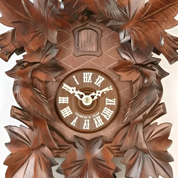 Elegant retro cuckoo pendulum clock, intricately carved wood with forest animals and quartz movement for stylish home decor.