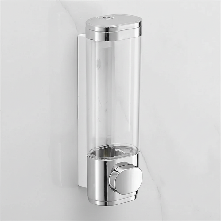 Close-up of a retro wall-mounted soap dispenser, showing vintage details