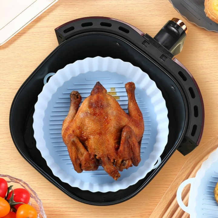 Reusable silicone air fryer basket for easy cleaning & healthy cooking. Nonstick kitchen accessory.