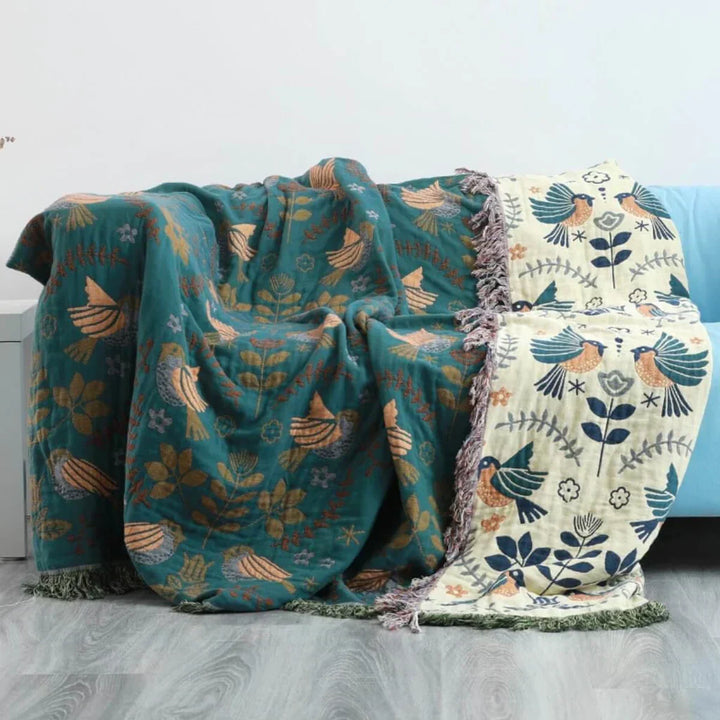Machine washable Scandinavian bird pattern cotton blanket, a decorative and functional home textile.
