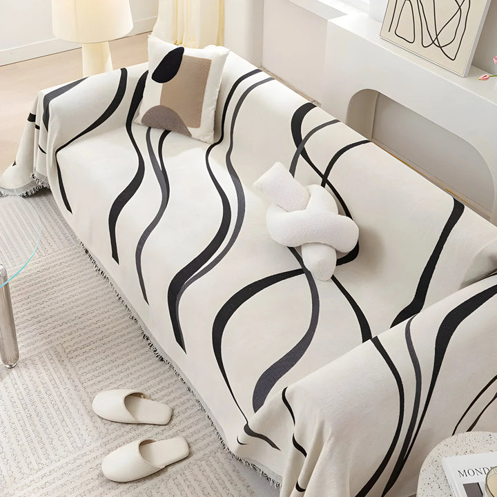 Soft reversible gray/khaki chenille cotton couch protector, enhancing home decor with comfort & style.