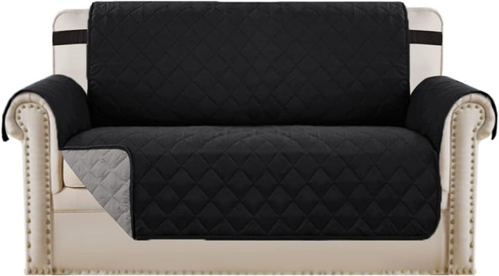 Waterproof sofa cover with elastic straps, ensuring a snug fit for maximum furniture protection.